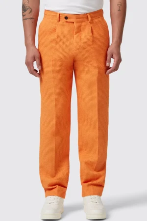 Twisted Tailor Gaufre Orange Waffle Knit Cotton Trousers | Unisex